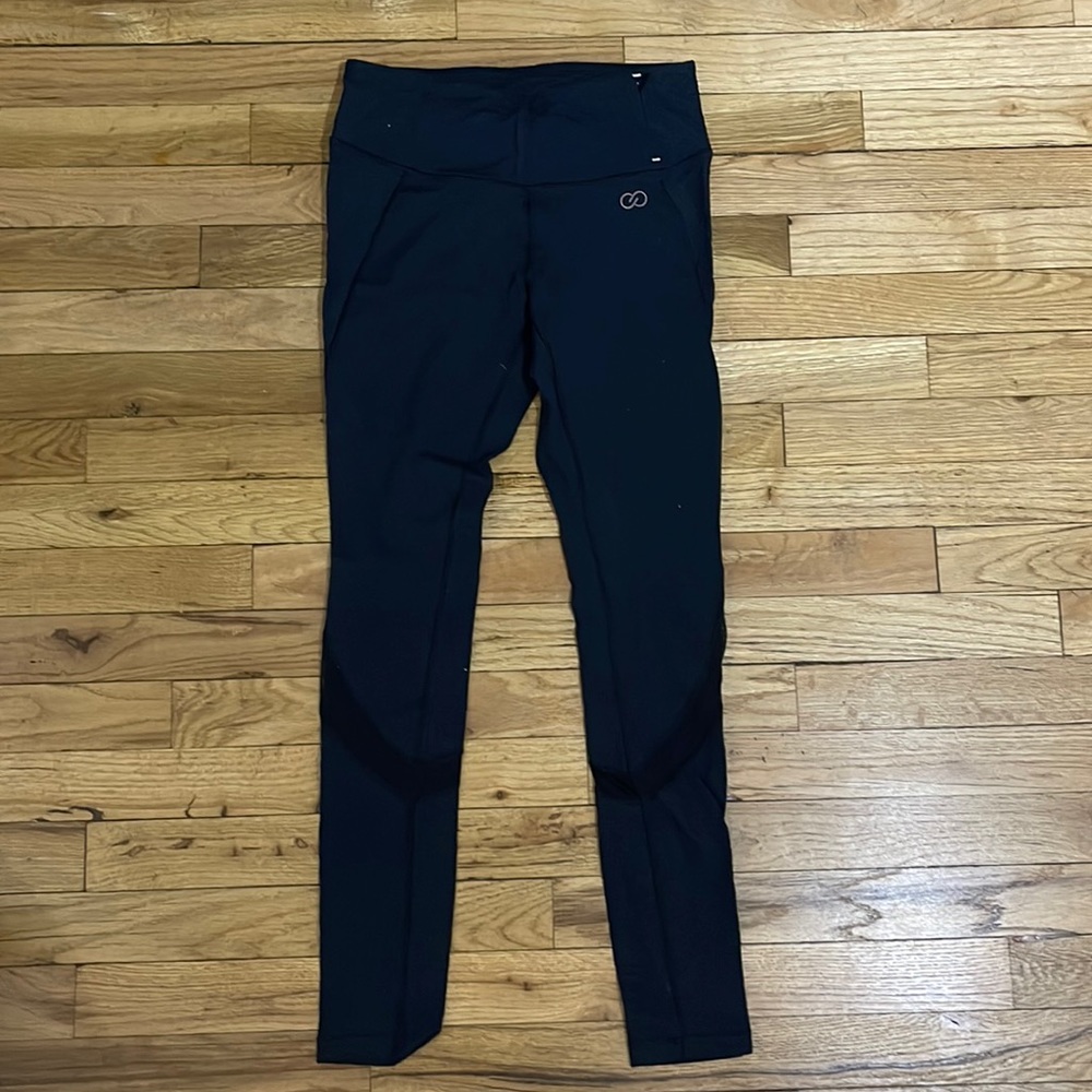 Black Calia brand leggings with mesh detailing at the knee, size small